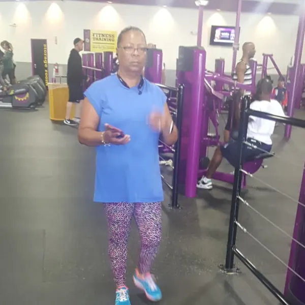 Barbara walking through the gym